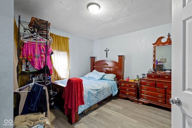 bedroom with hardwood / wood-style flooring