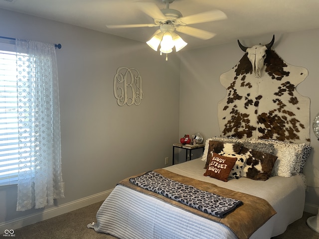 bedroom with ceiling fan and carpet