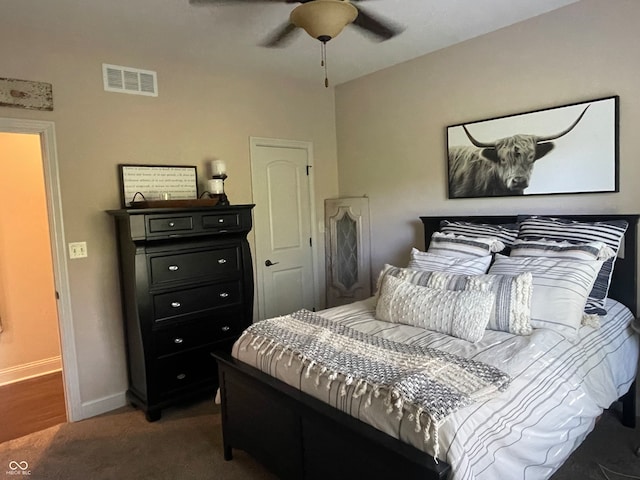 bedroom featuring dark carpet and ceiling fan