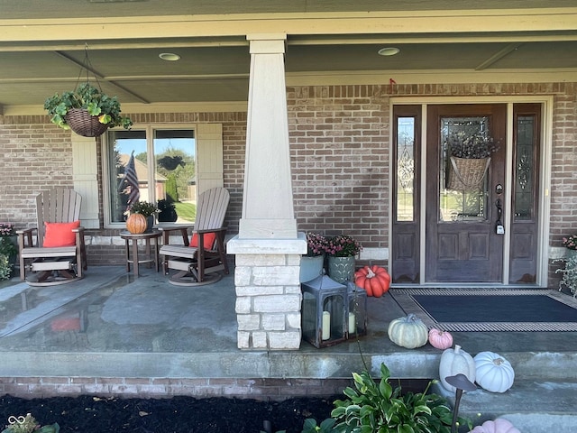 property entrance with covered porch