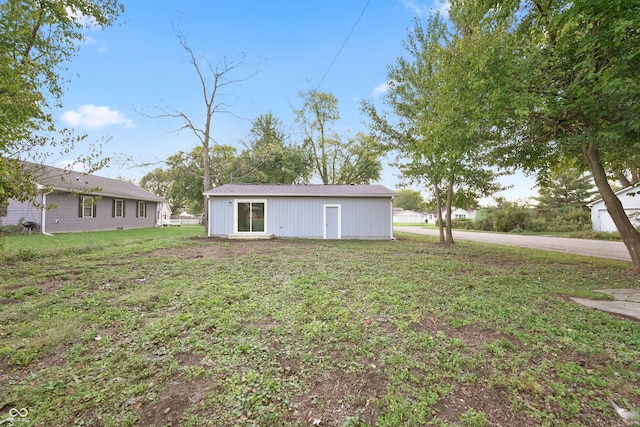 rear view of house with a lawn