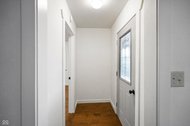 corridor featuring dark hardwood / wood-style flooring