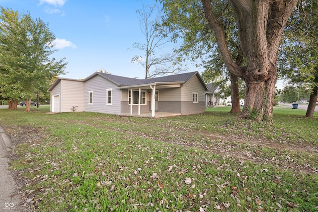 back of house featuring a patio and a yard