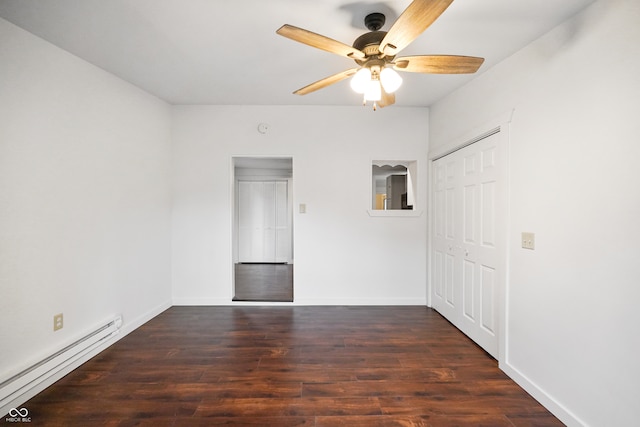 unfurnished bedroom featuring ceiling fan, a closet, dark hardwood / wood-style floors, and a baseboard heating unit