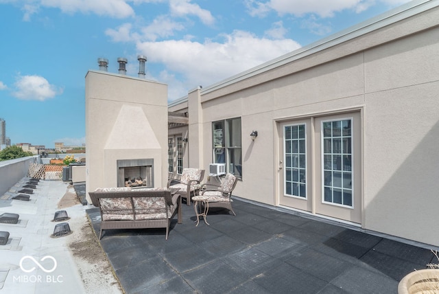 view of patio / terrace featuring an outdoor fireplace