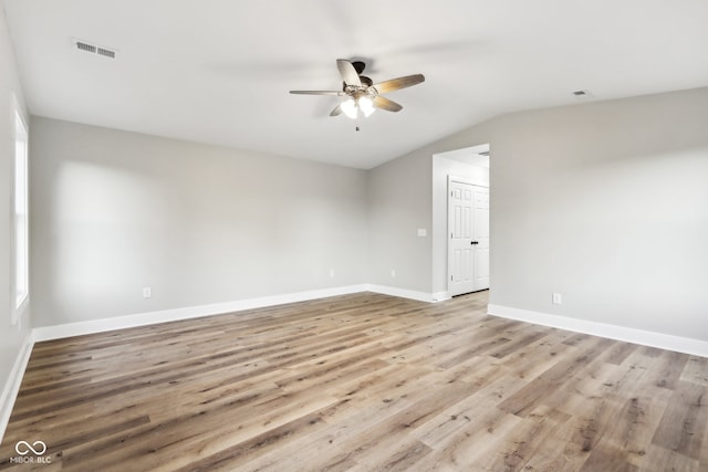 unfurnished room featuring lofted ceiling, ceiling fan, and light hardwood / wood-style flooring