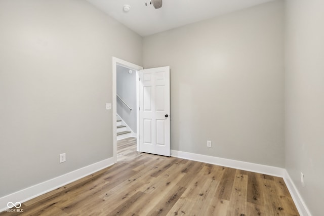 unfurnished room with light hardwood / wood-style floors and ceiling fan