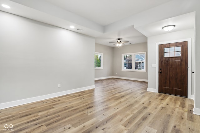 foyer featuring light wood-type flooring and ceiling fan