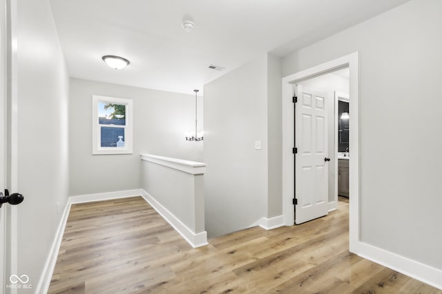 corridor featuring light wood-type flooring