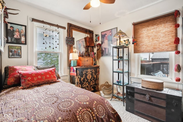 bedroom with ceiling fan and carpet flooring