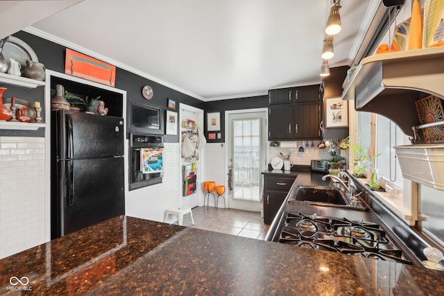 kitchen with black fridge, light tile patterned flooring, sink, dark brown cabinetry, and ornamental molding