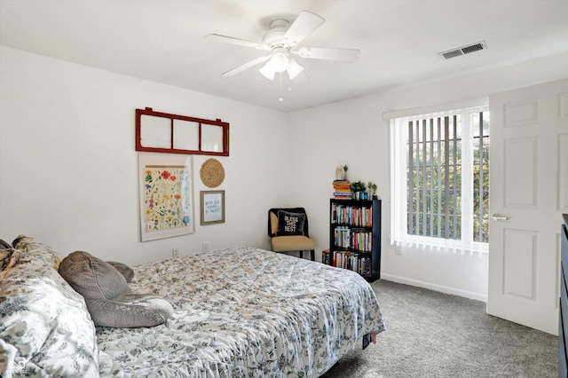 6517 Emerald Hill Ct Apt 312, Indianapolis, IN 46237 - bedroom with carpet, visible vents, baseboards, and a ceiling fan