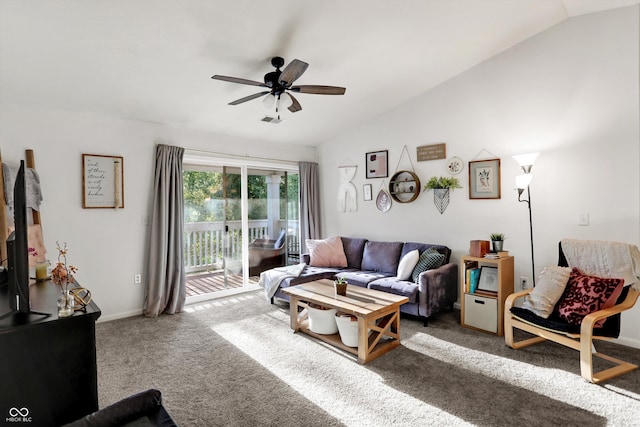 living room featuring ceiling fan, lofted ceiling, and carpet