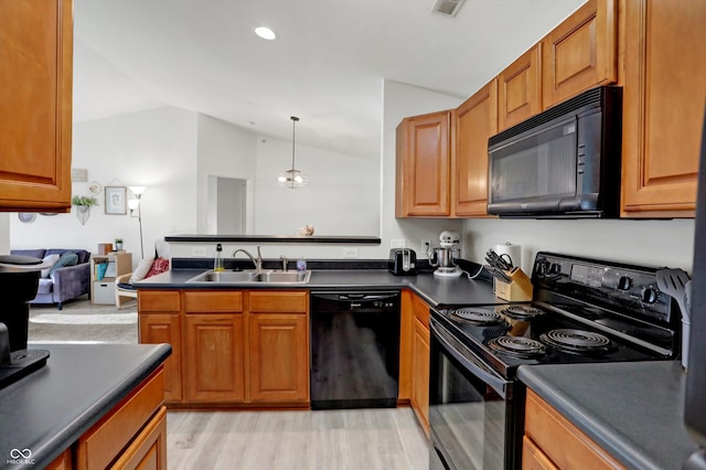 kitchen with sink, light hardwood / wood-style flooring, vaulted ceiling, and black appliances