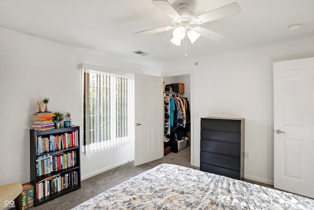 bedroom with dark carpet, a closet, and ceiling fan