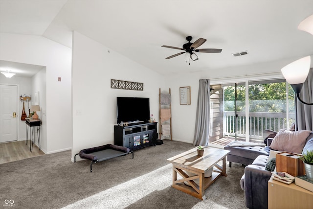 living room featuring carpet, vaulted ceiling, and ceiling fan