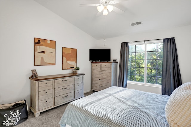 bedroom with lofted ceiling, light carpet, and ceiling fan