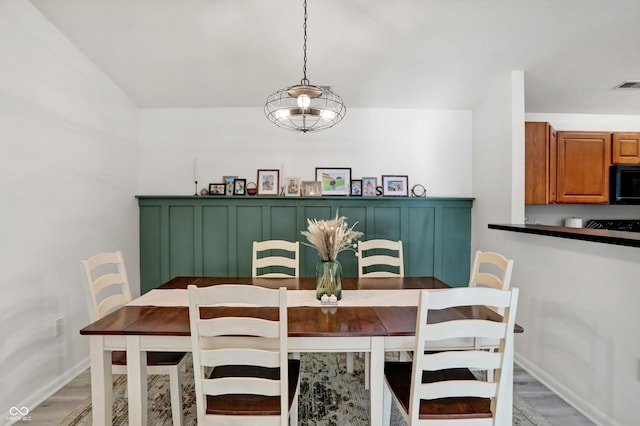 dining space featuring hardwood / wood-style flooring