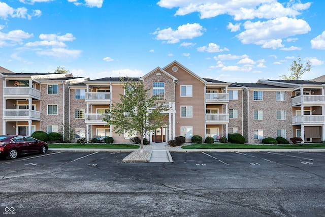6517 Emerald Hill Ct Apt 312, Indianapolis, IN 46237 - view of property featuring uncovered parking