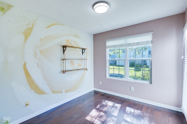 unfurnished room with dark wood-type flooring