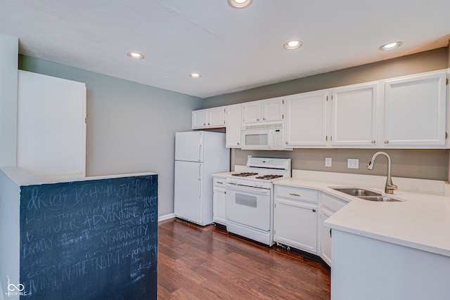 kitchen with white cabinets, white appliances, dark wood-type flooring, and sink