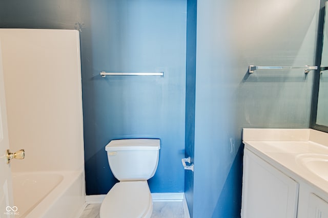 bathroom featuring vanity, toilet, and a bathing tub