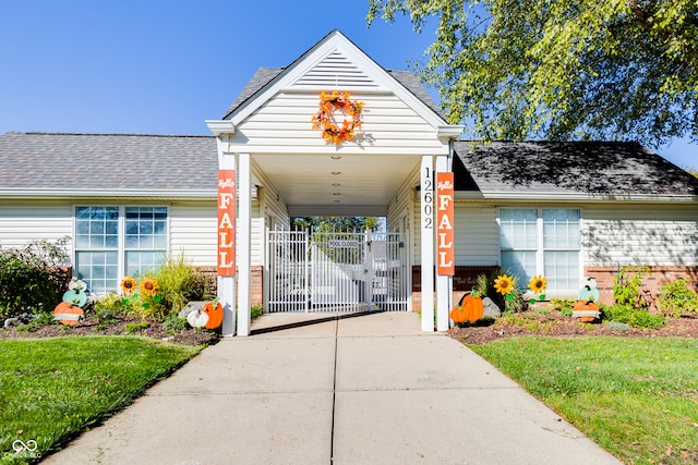 doorway to property with a yard