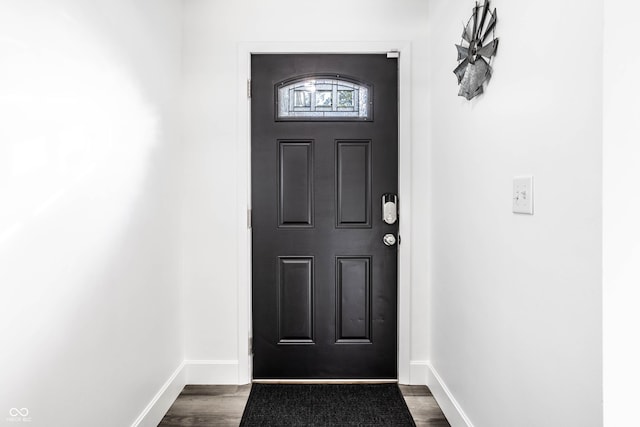 entryway with dark wood-type flooring