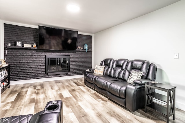 living room with a fireplace and hardwood / wood-style floors