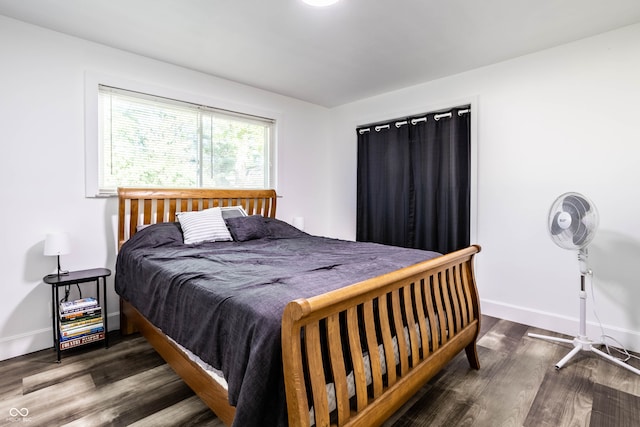 bedroom featuring dark hardwood / wood-style flooring