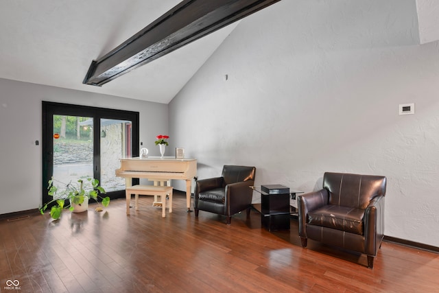 sitting room featuring hardwood / wood-style flooring and vaulted ceiling