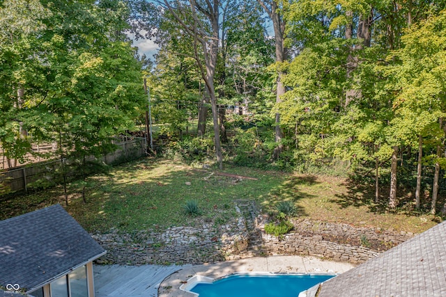 view of yard with a pool side deck