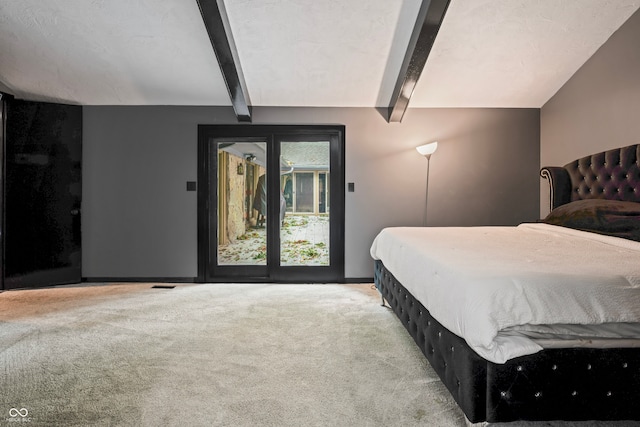 bedroom featuring light carpet and beamed ceiling