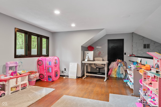 game room with lofted ceiling and hardwood / wood-style floors