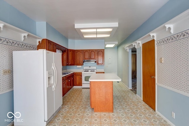 kitchen featuring white appliances and a kitchen island