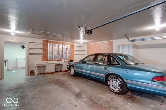 garage with a garage door opener and washer / clothes dryer