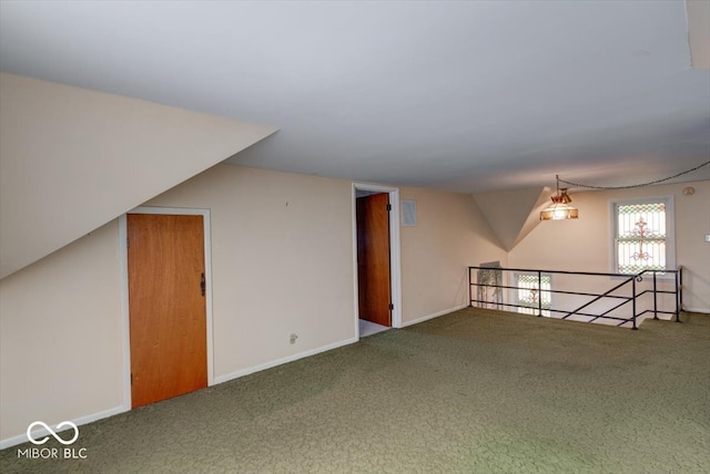 additional living space featuring carpet floors