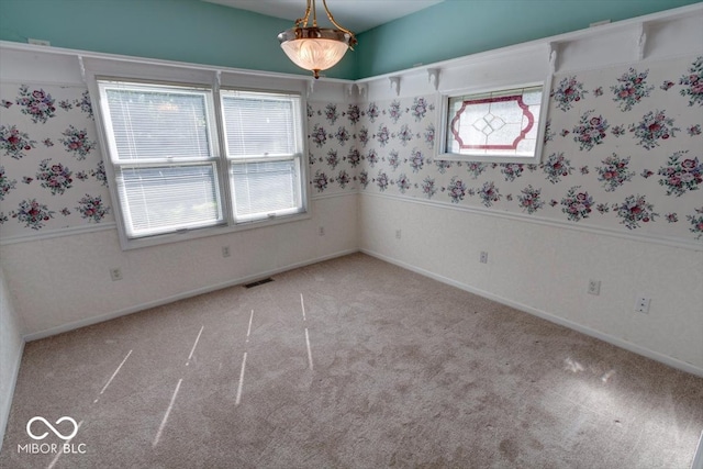 unfurnished room with light colored carpet