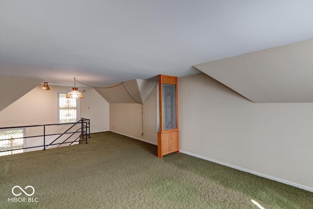 additional living space with lofted ceiling and carpet