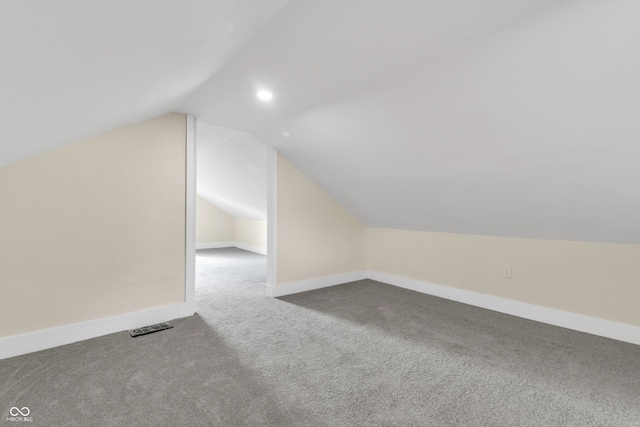 bonus room featuring carpet flooring and vaulted ceiling