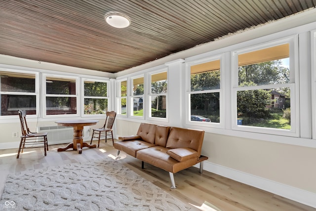 sunroom with wood ceiling and plenty of natural light