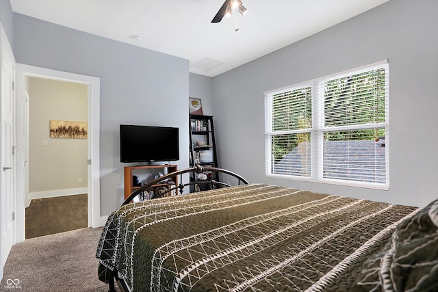 bedroom with ceiling fan and baseboards