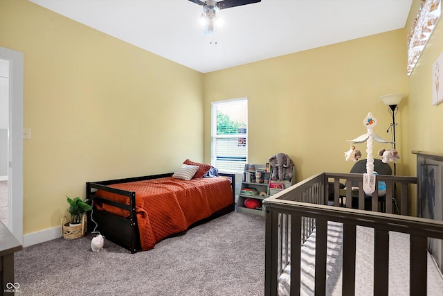 bedroom with carpet, ceiling fan, and baseboards