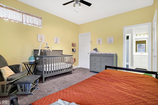 carpeted bedroom with ceiling fan and baseboards