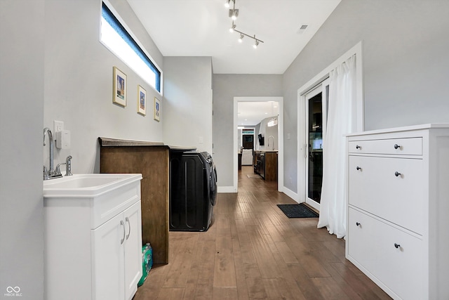 bathroom featuring hardwood / wood-style floors, vanity, and baseboards