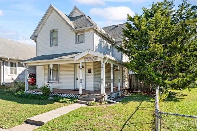 view of front facade with covered porch and a front lawn