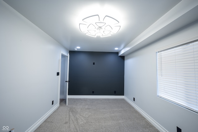 unfurnished room featuring carpet flooring