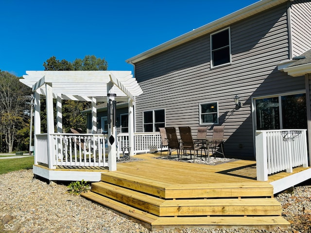 back of house featuring a pergola and a wooden deck