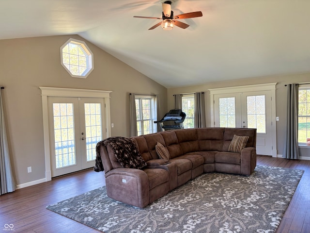 living room featuring ceiling fan, french doors, high vaulted ceiling, and dark wood-type flooring