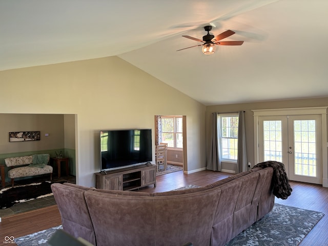 living room featuring ceiling fan, french doors, high vaulted ceiling, and dark wood-type flooring